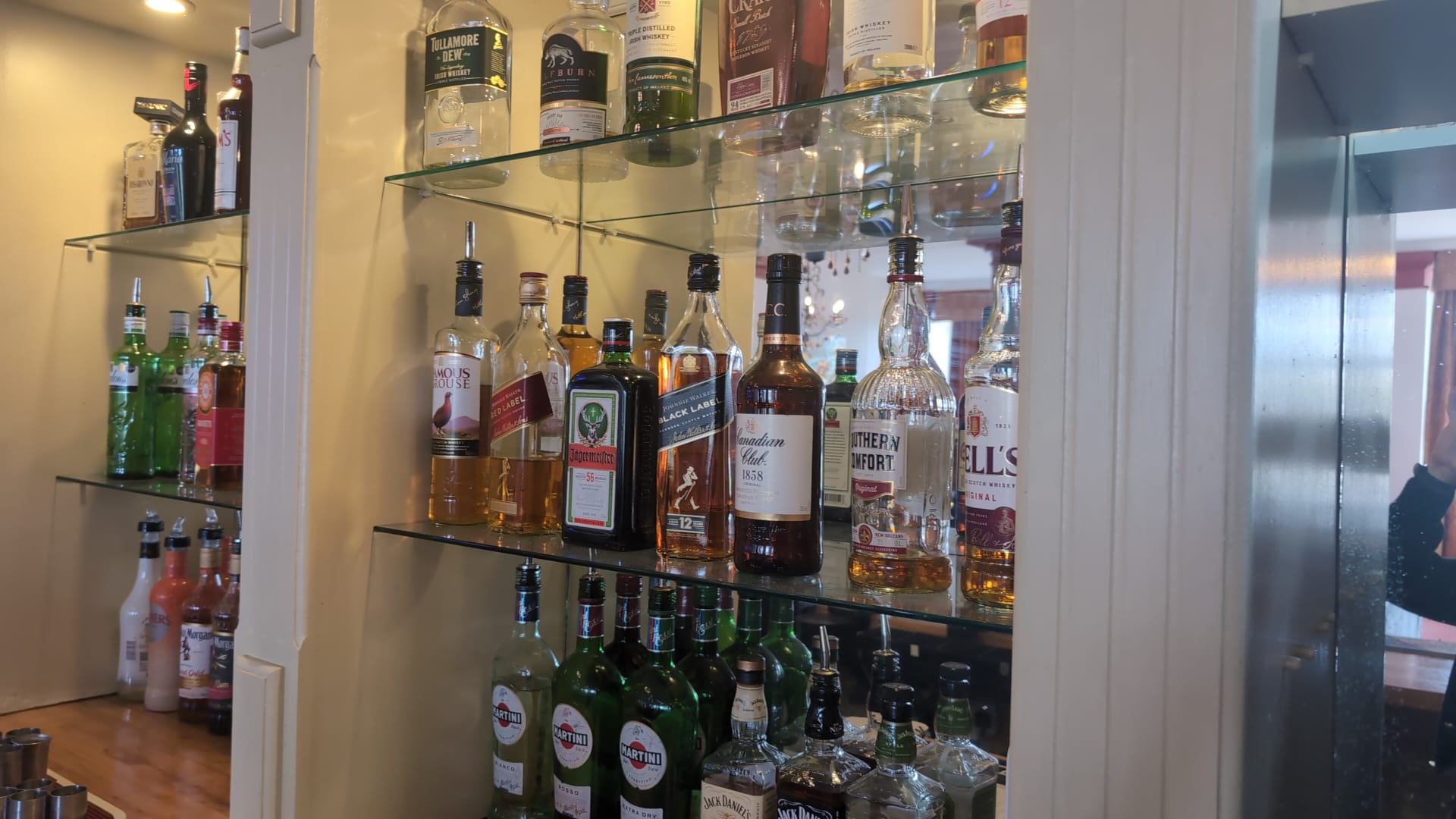 Spirits bottles on the back-bar shelf