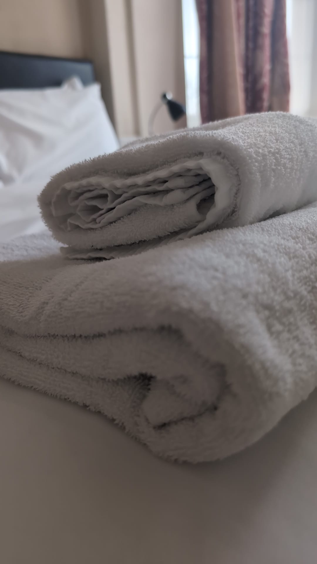 Rolled towels on bed - The Royal Hotel, Skegness