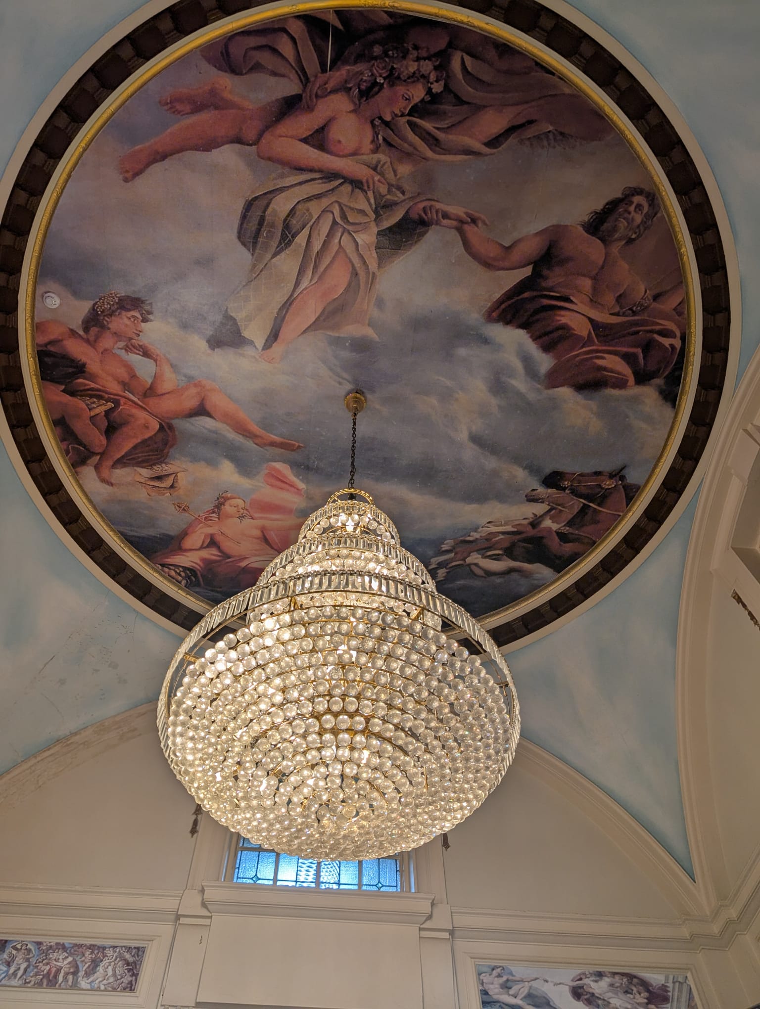 Painted ceiling fresco with hanging chandelier
