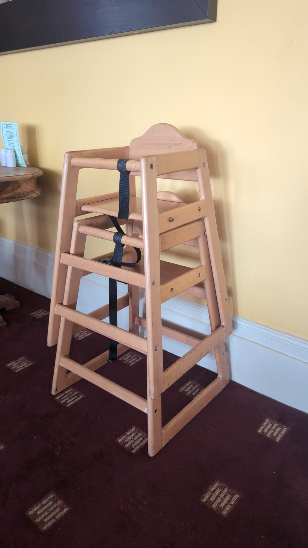 Wooden high chair available in the dining room