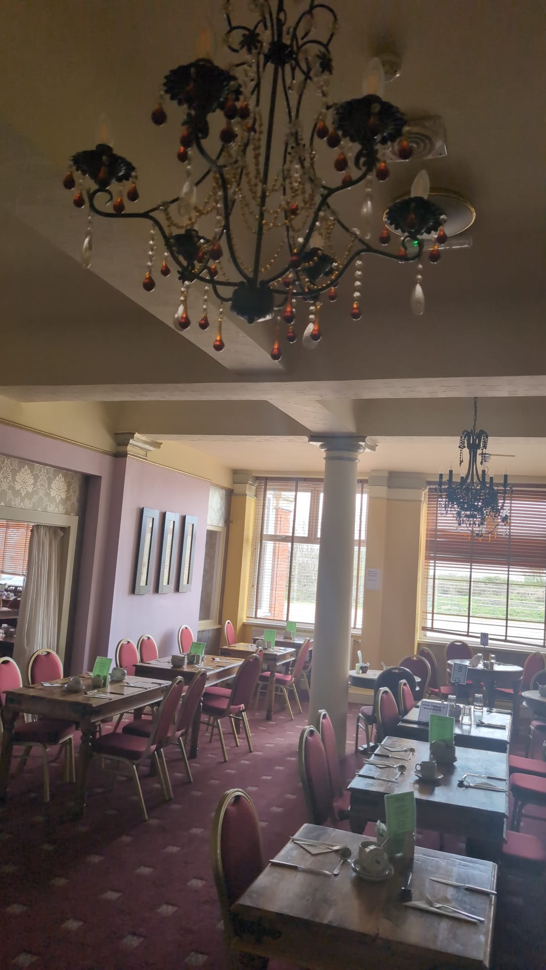 Crystal chandelier above set restaurant tables - The Royal Hotel, Skegness