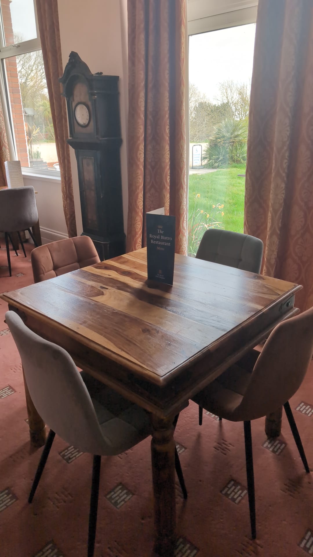 Restaurant table beside the garden-view window