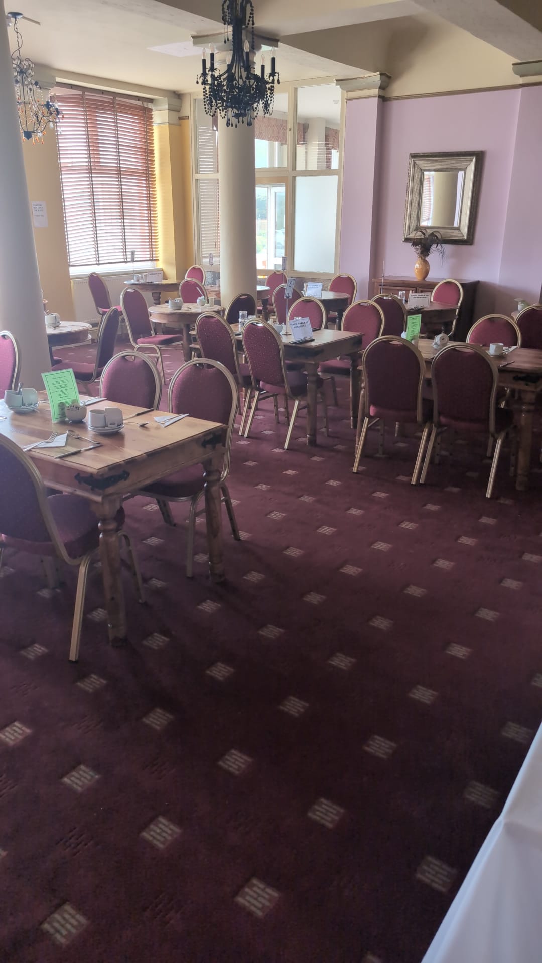 Restaurant tables with ornate mirror on back wall - The Royal Hotel, Skegness