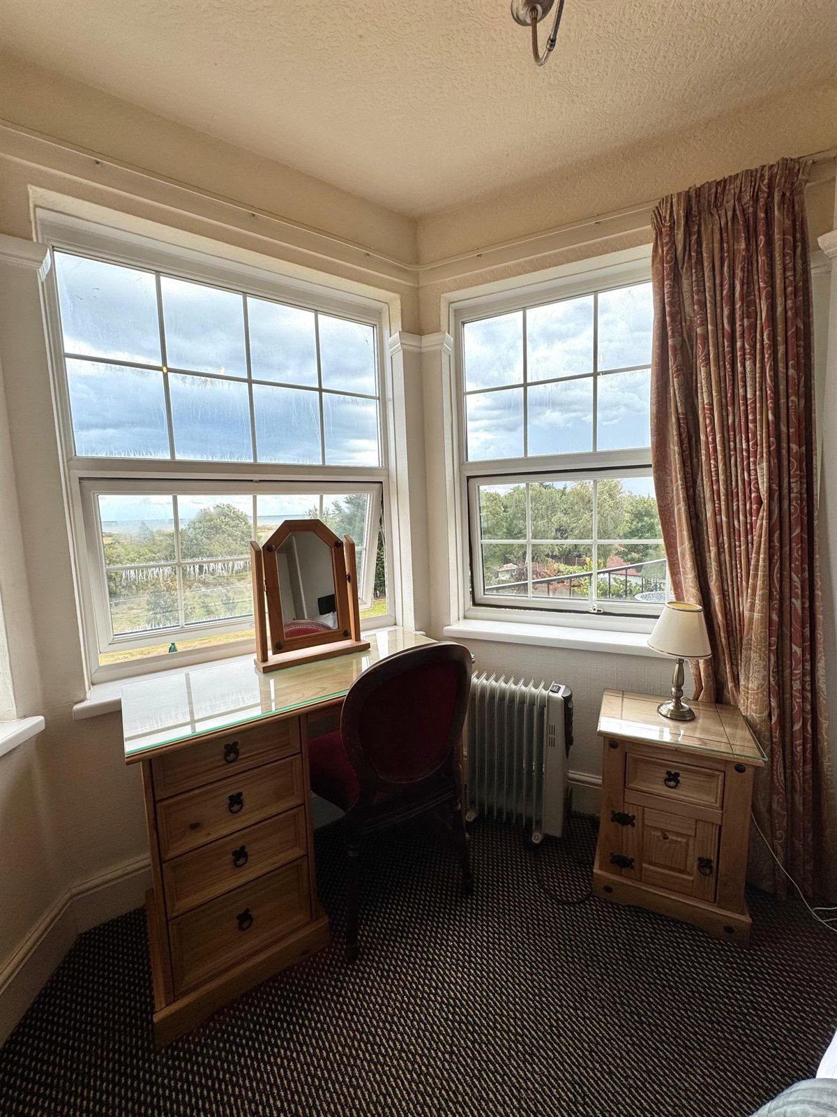 Guest room desk beside the bay window