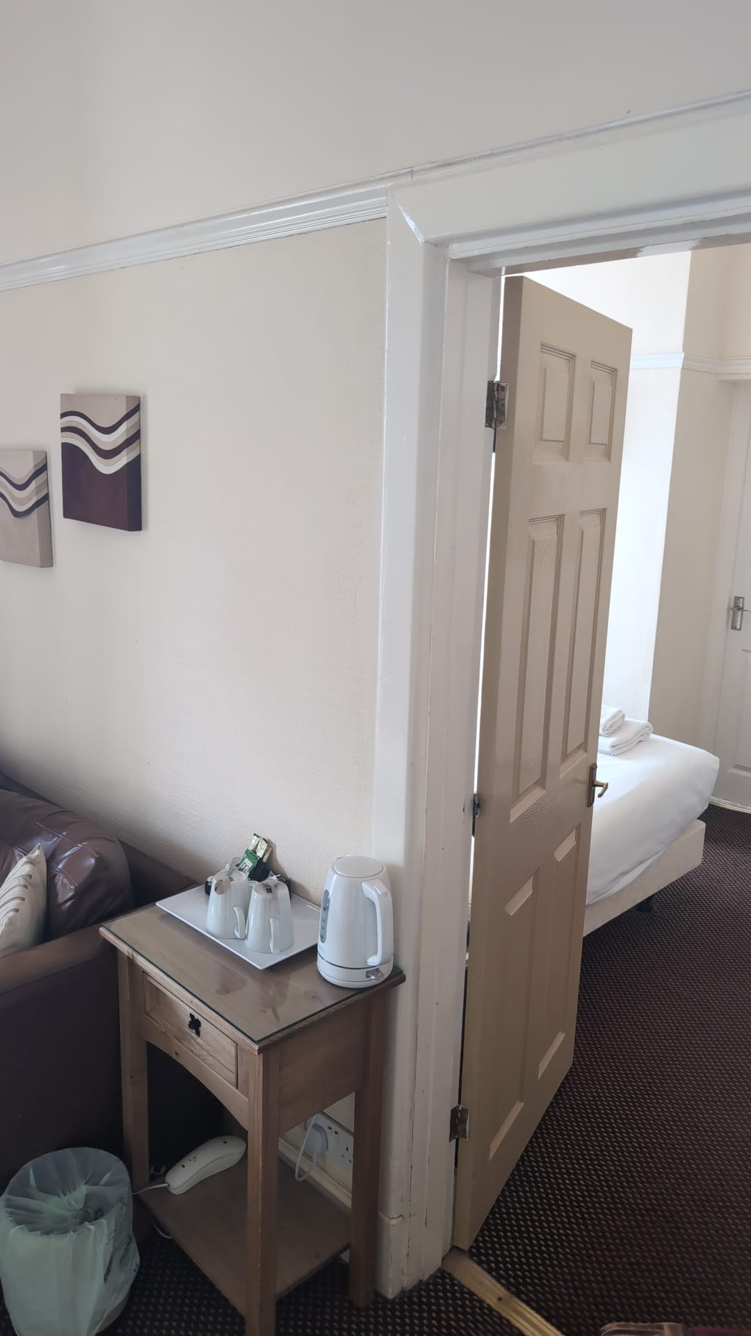 Guest room corner with tea tray and sofa