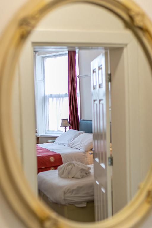 Artistic mirror detail in a guest room