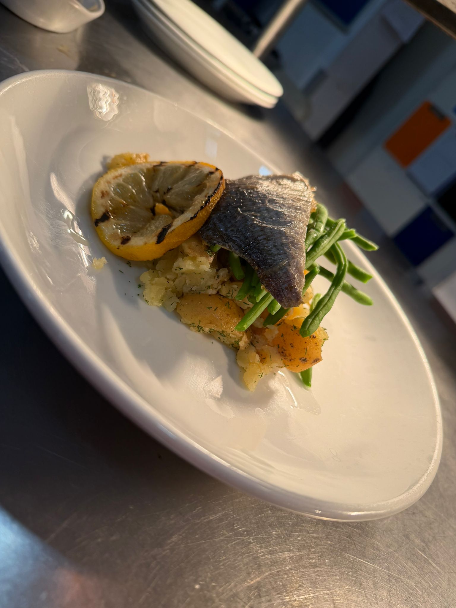 Plated seabass dish, wide view