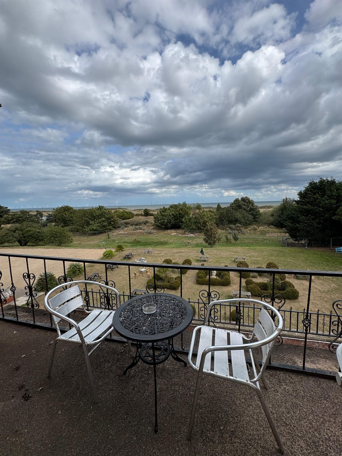 Balcony with cafe table and sea view