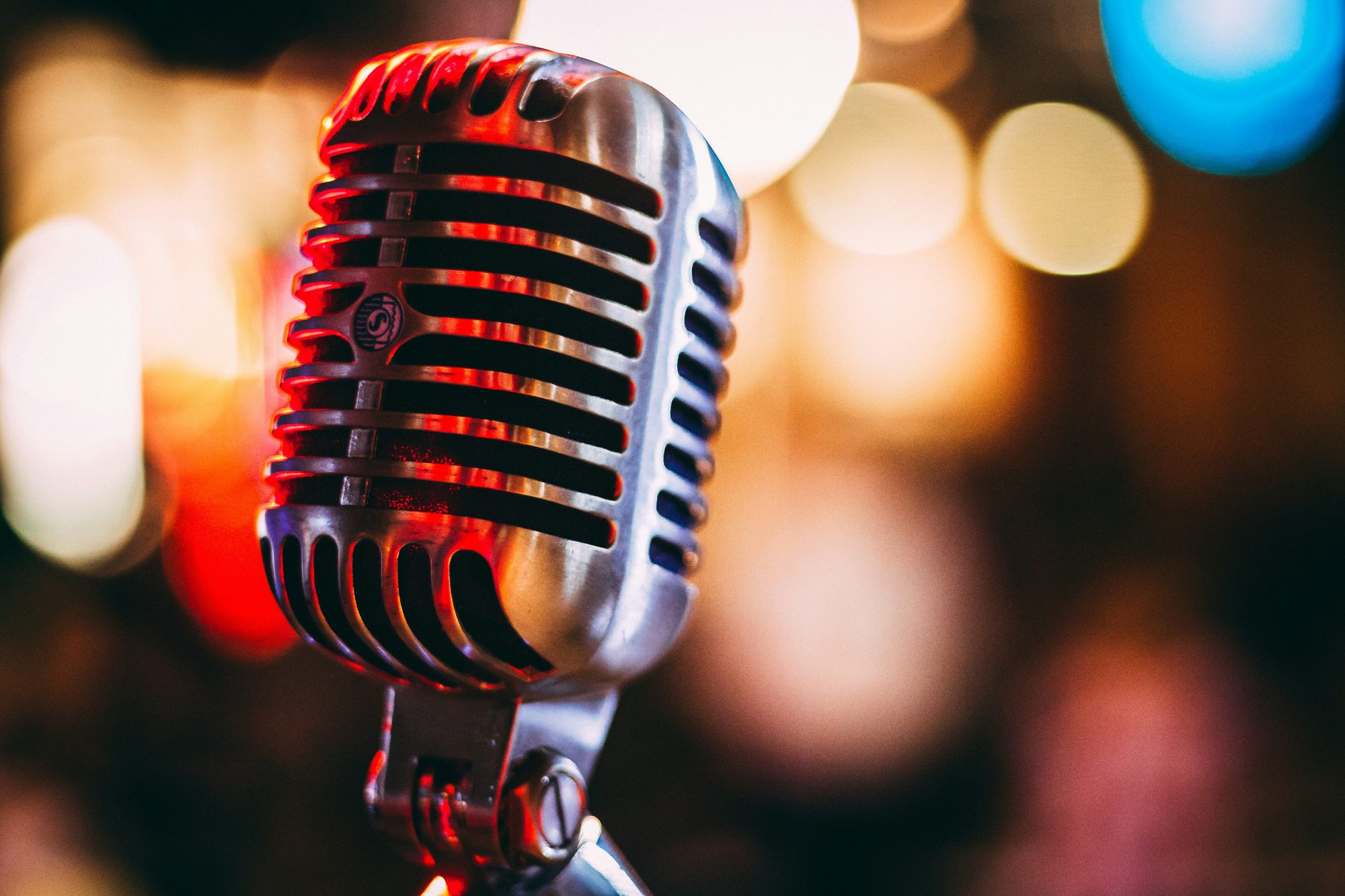 Vintage microphone under stage lighting